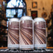  'Awwww! How Cute Is This?' con una fotografía de las vías del metro de Nueva York, evocando la inspiración urbana de esta cerveza.