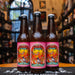Fauna VI, una Saison artesanal de 6.5% ABV. La etiqueta destaca por su arte psicodélico con aves y flores sobre fondo rosa. Cerveza refrescante, especiada y de perfil belga.