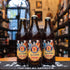  Paulaner Salvator, Doppelbock de 7.9% ABV, con una etiqueta clásica que muestra a dos monjes brindando. Su color ámbar oscuro y su perfil maltoso la convierten en una joya cervecera ideal para disfrutar lentamente.