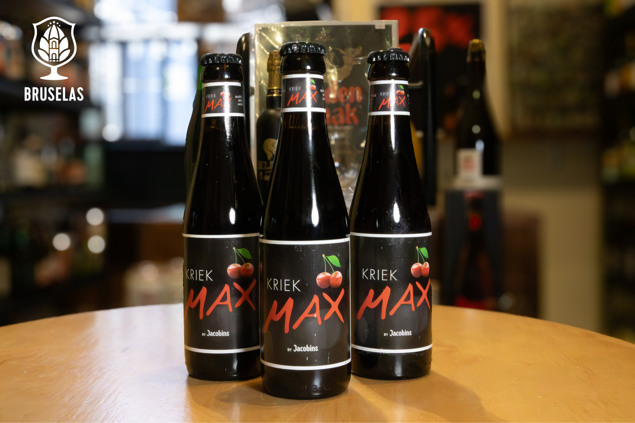 3 cervezas Kriek Max de Jacobins sobre una mesa de madera
